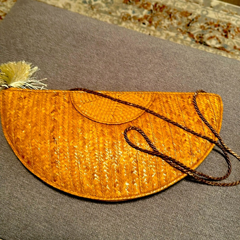 Cute half moon woven purse.  Great condition.. no damage. Great summer bag.